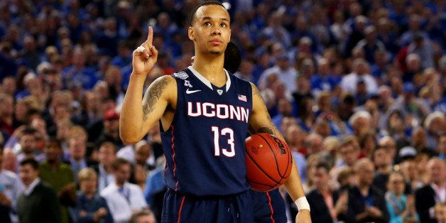 ARLINGTON, TX - APRIL 05: Shabazz Napier #13 of the Connecticut Huskies celebrates during the NCAA Men's Final Four Semifinal against the Florida Gators at AT&T Stadium on April 5, 2014 in Arlington, Texas. The Connecticut Huskies defeated the Florida Gators 63-53. (Photo by Ronald Martinez/Getty Images)