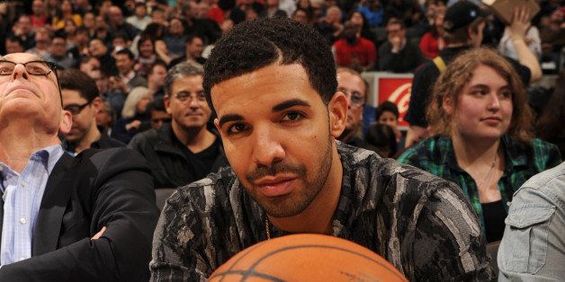 TORONTO, CANADA - April 4: Hip-Hop artist, Drake, attends a game between the Toronto Raptors and the Indiana Pacers on April 4, 2014 at the Air Canada Centre in Toronto, Ontario, Canada. NOTE TO USER: User expressly acknowledges and agrees that, by downloading and or using this Photograph, user is consenting to the terms and conditions of the Getty Images License Agreement. Mandatory Copyright Notice: Copyright 2014 NBAE (Photo by Ron Turenne/NBAE via Getty Images)