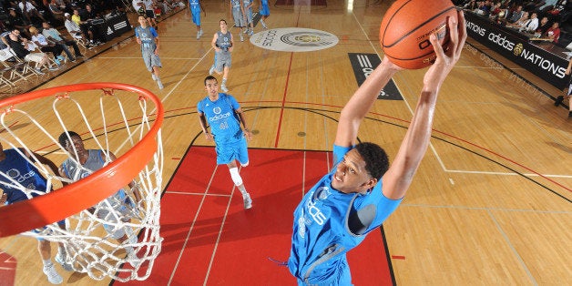 LONG BEACH, CA - August 6: Jahlil Okafor of the Blue Team with the dunk during the adidas Nations on August 6, 2012 at Long Beach City College in Long Beach, California. (Photo by Kelly Kline/Getty Images)