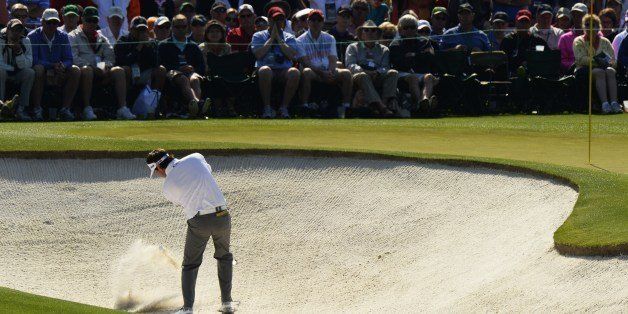 Bubba Watson of the US plays a shot out of a bunker on second hole during the second round of the 78th Masters Golf Tournament at Augusta National Golf Club on April 11, 2014 in Augusta, Georgia. AFP PHOTO/Timothy A. CLARY (Photo credit should read TIMOTHY A. CLARY/AFP/Getty Images)