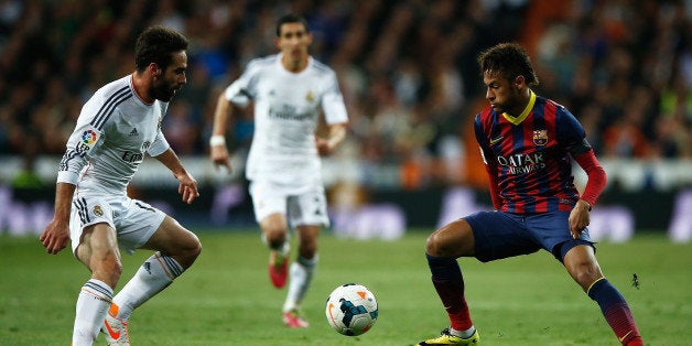 MADRID, SPAIN - MARCH 23: Daniel Carvajal of Real Madrid closes down Neymar of Barcelona during the La Liga match between Real Madrid CF and FC Barcelona at the Bernabeu on March 23, 2014 in Madrid, Spain. (Photo by Gonzalo Arroyo Moreno/Getty Images)