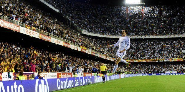 Real Madrid's Welsh forward Gareth Bale celebrates after scoring during the Spanish Copa del Rey (King's Cup) final 'Clasico' football match FC Barcelona vs Real Madrid CF at the Mestalla stadium in Valencia on April 16, 2014. AFP PHOTO/ DANI POZO (Photo credit should read DANI POZO/AFP/Getty Images)