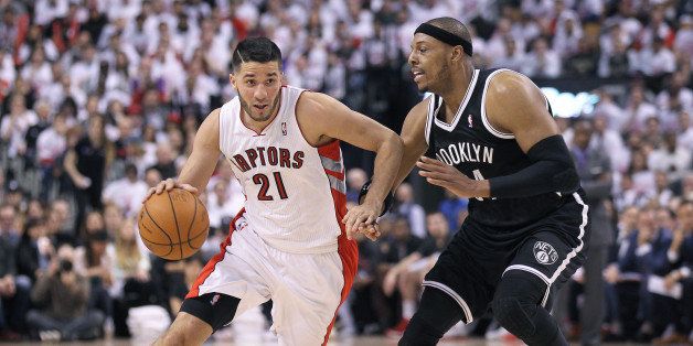 TORONTO, ON - APRIL 19: Greivis Vasquez #21 of the Toronto Raptors breaks around Paul Pierce #34 of the Brooklyn Nets in Game One of the NBA Eastern Conference play-off at the Air Canada Centre on April 19, 2014 in Toronto, Ontario, Canada. The Nets defeated the Raptors 94-87 to take a 1-0 series lead. NOTE TO USER: user expressly acknowledges and agrees that, by downloading and/or using this Photograph, user is consenting to the terms and conditions of the Getty Images License Agreement. (Photo by Claus Andersen/Getty Images) 