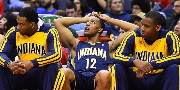 Indiana Pacers forward Evan Turner (12) and teammates sit on the bench in the closing moments of their lost against the Washington Wizards at the Verizon Center in Washington, Friday, Mar. 28, 2014. Washington defeated Indiana 91-78. (Harry E. Walker/MCT via Getty Images)