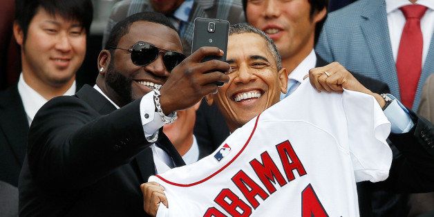 WASHINGTON, DC - APRIL 01: Boston Red Sox designated hitter David Ortiz (L) poses for a 'selfie' with U.S. President Barack Obama during a ceremony on the South Lawn of the White House to honor the 2013 World Series Champion Boston Red Sox April 1, 2014 in Washington, DC. The Red Sox defeated the St. Louis Cardinals in the 2013 World Series.(Photo by Win McNamee/Getty Images)