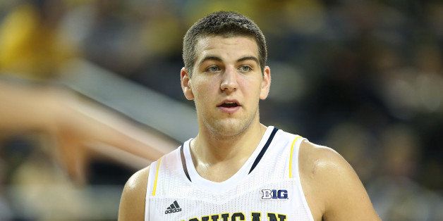 ANN ARBOR, MI - DECEMBER 07: Mitch McGary #4 of the University of Michigan Wolverines looks to defend during the second half of the game against Houston Baptist Huskies at the Crisler Center on December 7, 2013 in Ann Arbor, Michigan. Michigan defeated Houston 107-53. (Photo by Leon Halip/Getty Images)