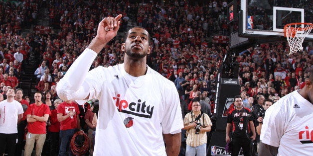 PORTLAND, OR - APRIL 25: LaMarcus Aldridge #12 of the Portland Trail Blazers stands for the National Anthem before a game aga