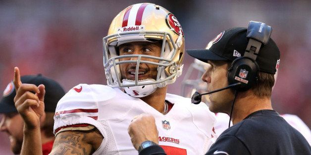 GLENDALE, AZ - DECEMBER 29: (L-R) Colin Kaepernick #7 of the San Francisco 49ers talks with head coach Jim Harbaugh on the sidelines against the Arizona Cardinals during a game at University of Phoenix Stadium on December 29, 2013 in Glendale, Arizona. (Photo by Christian Petersen/Getty Images)