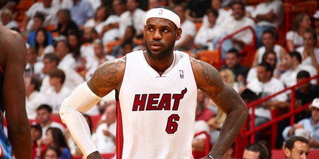 MIAMI, FL - APRIL 23: LeBron James #6 of the Miami Heat looks on during the game against the Charlotte Bobcats in Game Two of the Eastern Conference Quarterfinals of the 2014 NBA playoffs at American Airlines Arena in Miami, Florida on April 23, 2014. NOTE TO USER: User expressly acknowledges and agrees that, by downloading and or using this photograph, User is consenting to the terms and conditions of the Getty Images License Agreement. Mandatory Copyright Notice: Copyright 2014 NBAE (Photo by Nathaniel S. Butler/NBAE via Getty Images)