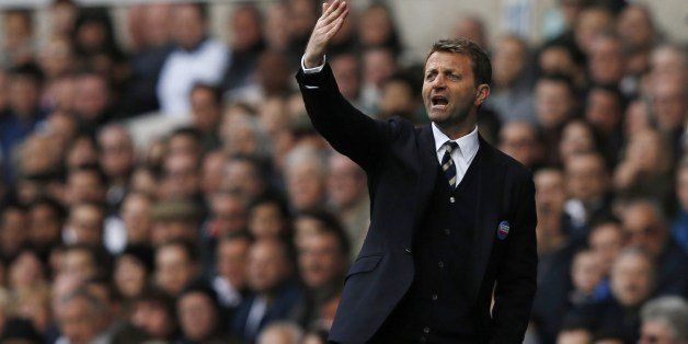 Tottenham Hotspur's English Head Coach Tim Sherwood gestures from the touchline during the English Premier League football match between Tottenham Hotspur and Fulham at White Hart Lane in north London on April 19, 2014. AFP PHOTO / ADRIAN DENNISRESTRICTED TO EDITORIAL USE. No use with unauthorized audio, video, data, fixture lists, club/league logos or live services. Online in-match use limited to 45 images, no video emulation. No use in betting, games or single club/league/player publications. (Photo credit should read ADRIAN DENNIS/AFP/Getty Images)