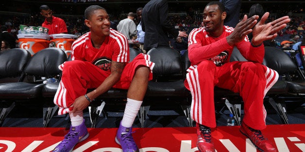 WASHINGTON, DC - JANUARY 20: Bradley Beal #3 and John Wall #2 of the Washington Wizards wait for pre-game announcements again