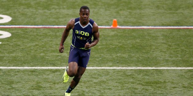 INDIANAPOLIS, IN - FEBRUARY 23: Former Louisville quarterback Teddy Bridgewater participates in a drill during the 2014 NFL Combine at Lucas Oil Stadium on February 23, 2014 in Indianapolis, Indiana. (Photo by Joe Robbins/Getty Images)