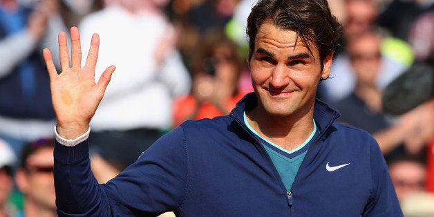 MONTE-CARLO, MONACO - APRIL 20: Roger Federer of Switzerland thanks the support after losing to Stanislas Wawrinka of Switze