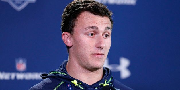 INDIANAPOLIS, IN - FEBRUARY 21: Former Texas A&M quarterback Johnny Manziel speaks to the media during the 2014 NFL Combine at Lucas Oil Stadium on February 21, 2014 in Indianapolis, Indiana. (Photo by Joe Robbins/Getty Images) 