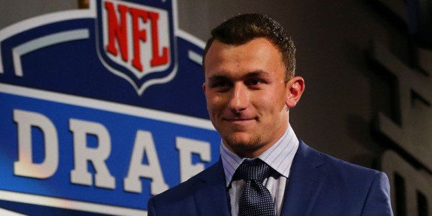NEW YORK, NY - MAY 08: Johnny Manziel of the Texas A&M Aggiesis introduced during the first round of the 2014 NFL Draft at Radio City Music Hall on May 8, 2014 in New York City. (Photo by Elsa/Getty Images)