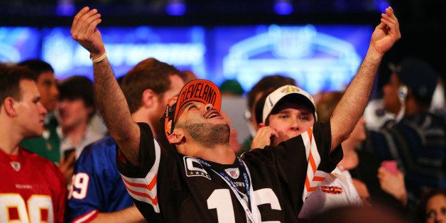 NEW YORK, NY - MAY 08: A fan reacts as Johnny Manziel of the Texas A&M Aggies is picked #22 overall by the Cleveland Browns during the first round of the 2014 NFL Draft at Radio City Music Hall on May 8, 2014 in New York City. (Photo by Elsa/Getty Images)