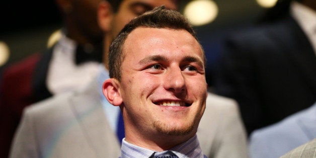 NEW YORK, NY - MAY 08: Johnny Manziel of the Texas A&M Aggiesis introduced during the first round of the 2014 NFL Draft at Radio City Music Hall on May 8, 2014 in New York City. (Photo by Elsa/Getty Images)