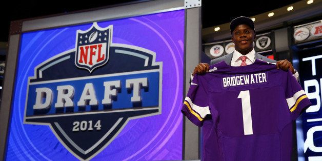 NEW YORK, NY - MAY 08: Teddy Bridgewater of the Louisville Cardinals poses with a jersey after he was picked #32 overall by the Minnesota Vikings during the first round of the 2014 NFL Draft at Radio City Music Hall on May 8, 2014 in New York City. (Photo by Elsa/Getty Images)