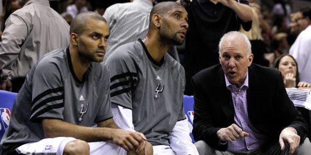 SAN ANTONIO, TX - MAY 29: (R-L) Head coach Gregg Popovich of the San Antonio Spurs talks to Tim Duncan #21 and Tony Parker #9 on the bench in the third quarter while taking on the Oklahoma City Thunder in Game Two of the Western Conference Finals of the 2012 NBA Playoffs at AT&T Center on May 29, 2012 in San Antonio, Texas. NOTE TO USER: User expressly acknowledges and agrees that, by downloading and or using this photograph, user is consenting to the terms and conditions of the Getty Images License Agreement. (Photo by Tom Pennington/Getty Images)