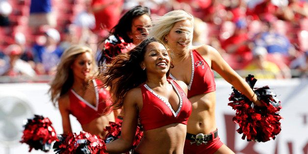 TAMPA, FL - December 8: Members of the Tampa Bay Buccaneers Cheerleaders perform during the game against the Buffalo Bills at Raymond James Stadium on December 8, 2013 in Tampa, Florida. Tampa Bay defeated Buffalo Bills 27-6. (Photo by Don Juan Moore/Getty Images)