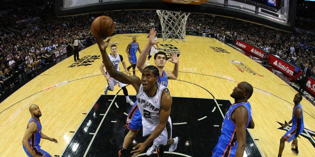 SAN ANTONIO, TX - MAY 19: Kawhi Leonard #2 of the San Antonio Spurs goes up for a shot against Steven Adams #12 of the Oklahoma City Thunder in the fourth quarter in Game One of the Western Conference Finals during the 2014 NBA Playoffs at AT&T Center on May 19, 2014 in San Antonio, Texas. NOTE TO USER: User expressly acknowledges and agrees that, by downloading and or using this photograph, User is consenting to the terms and conditions of the Getty Images License Agreement. (Photo by Ronald Martinez/Getty Images)