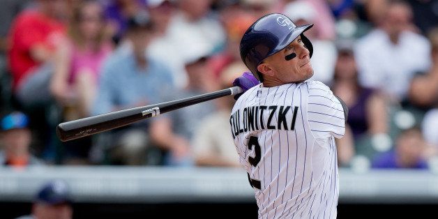 DENVER, CO - MAY 18: Troy Tulowitzki #2 of the Colorado Rockies hits a solo home run during the fifth inning against the San Diego Padres at Coors Field on May 18, 2014 in Denver, Colorado. The Rockies defeated the Padres 8-6 in 10 innings. (Photo by Justin Edmonds/Getty Images)