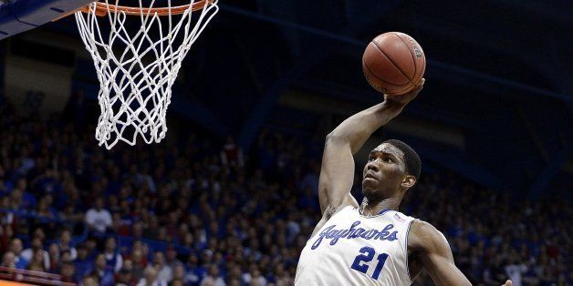 Kansas' Joel Embiid cocks the ball back and gets set to throw down a thunderous dunk over Texas' Javan Felix (3) during the first half on Saturday, Feb. 22, 2014, at Allen Fieldhouse in Lawrence, Kan. Kansas won, 85-54. (Rich Sugg/Kansas City Star/MCT via Getty Images)
