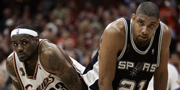 Cleveland, UNITED STATES: Tim Duncan (R) of the San Antonio Spurs and LeBron James (L) of the Cleveland Cavaliers prepare for a play during Game Four of the NBA Finals 14 June 2007 at Quicken Loans Arena in Cleveland, Ohio. The Spurs won 83-82 to sweep the best-of-seven series 4-0. AFP PHOTO/JEFF HAYNES (Photo credit should read JEFF HAYNES/AFP/Getty Images)