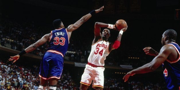 HOUSTON - JUNE 19: Hakeem Olajuwon #34 of the Houston Rockets shoots against Patrick Ewing #33 of the New York Knicks in Gam