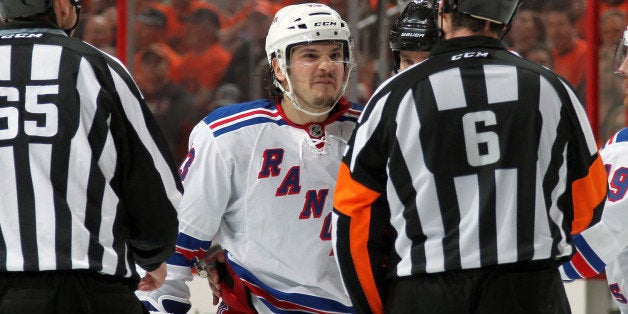 PHILADELPHIA, PA - APRIL 22: Dan Carcillo #13 of the New York Rangers argues a call with Referee Francis Charron #6 followin