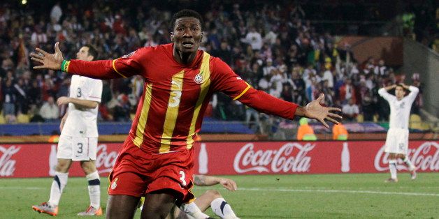 Ghana's Asamoah Gyan, foreground, celebrates after scoring the team's second goal during the World Cup round of 16 soccer match between the United States and Ghana at Royal Bafokeng Stadium in Rustenburg, South Africa, Saturday, June 26, 2010. (AP Photo/Matt Dunham)