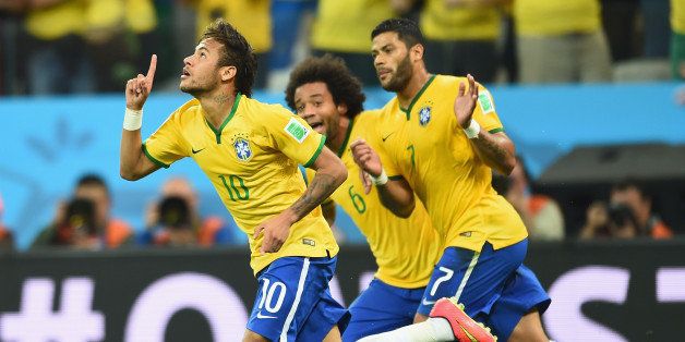 SAO PAULO, BRAZIL - JUNE 12: Neymar of Brazil celebrates scoring a first half goal with Marcelo and Hulk during the 2014 FIFA World Cup Brazil Group A match between Brazil and Croatia at Arena de Sao Paulo on June 12, 2014 in Sao Paulo, Brazil. (Photo by Buda Mendes/Getty Images)