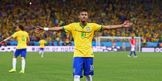 SAO PAULO, BRAZIL - JUNE 12: Neymar of Brazil celebrates after scoring his second goal on a penalty kick in the second half during the 2014 FIFA World Cup Brazil Group A match between Brazil and Croatia at Arena de Sao Paulo on June 12, 2014 in Sao Paulo, Brazil. (Photo by Adam Pretty/Getty Images)