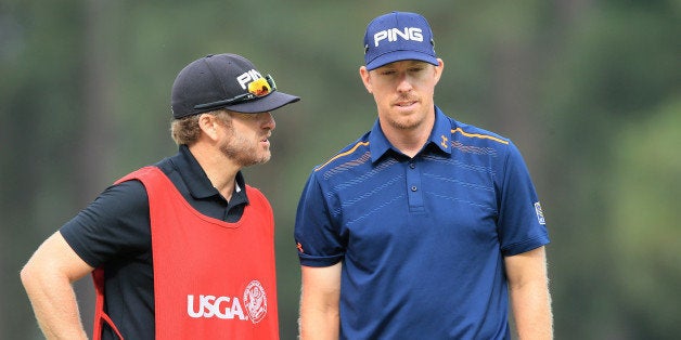 PINEHURST, NC - JUNE 13: Hunter Mahan of the United States waits on the 12th green with his caddie John Wood during the second round of the 114th U.S. Open at Pinehurst Resort & Country Club, Course No. 2 on June 13, 2014 in Pinehurst, North Carolina. (Photo by David Cannon/Getty Images)