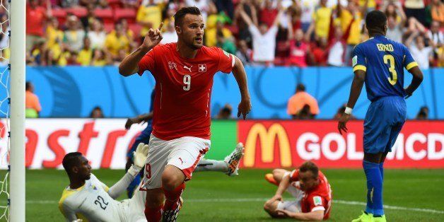 Switzerland's forward Haris Seferovic celebrates after scoring during a Group E football match between Switzerland and Ecuador at the Mane Garrincha National Stadium in Brasilia during the 2014 FIFA World Cup on June 15, 2014. Switzerland won 2-1. AFP PHOTO/ ANNE-CHRISTINE POUJOULAT (Photo credit should read ANNE-CHRISTINE POUJOULAT/AFP/Getty Images)