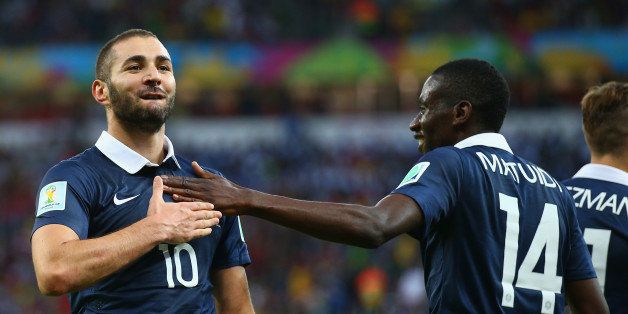 PORTO ALEGRE, BRAZIL - JUNE 15: Karim Benzema of France (L) celebrates after scoring his team's third goal with teammate Blaise Matuidi during the 2014 FIFA World Cup Brazil Group E match between France and Honduras at Estadio Beira-Rio on June 15, 2014 in Porto Alegre, Brazil. (Photo by Paul Gilham/Getty Images)