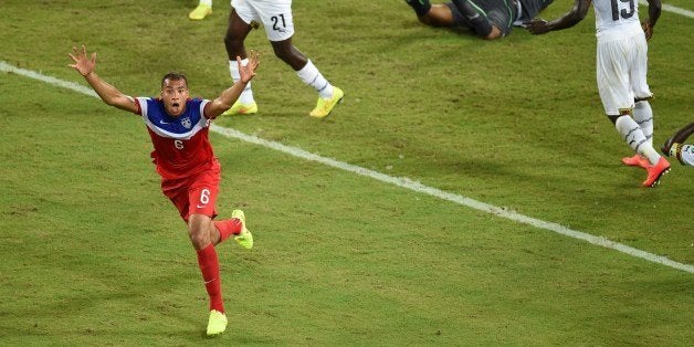 US defender John Brooks (L) celebrates after scoring during a Group G football match between Ghana and US at the Dunas Arena