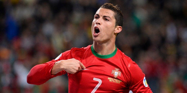 Portugal's forward Cristiano Ronaldo celebrates after scoring the second goal for Portugal during the FIFA 2014 World Cup pla