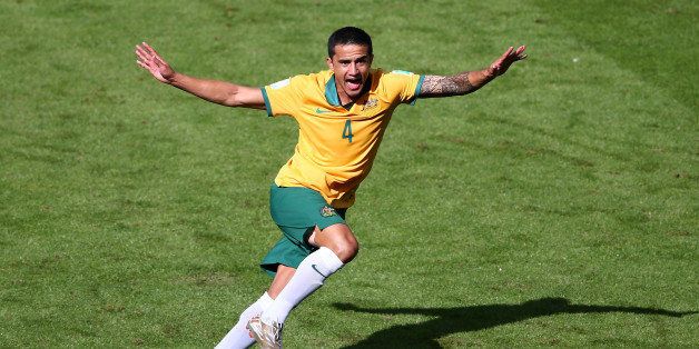PORTO ALEGRE, BRAZIL - JUNE 18: Tim Cahill of Australia celebrates after scoring his team's first goal during the 2014 FIFA World Cup Brazil Group B match between Australia and Netherlands at Estadio Beira-Rio on June 18, 2014 in Porto Alegre, Brazil. (Photo by Paul Gilham/Getty Images)