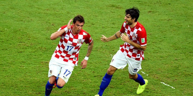 MANAUS, BRAZIL - JUNE 18: Mario Mandzukic of Croatia celebrates scoring his team's third goal during the 2014 FIFA World Cup