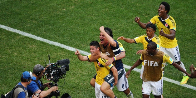 BRASILIA, BRAZIL - JUNE 19: James Rodriguez #10 of Colombia celebrates scoring his team's first goal during the 2014 FIFA Wo