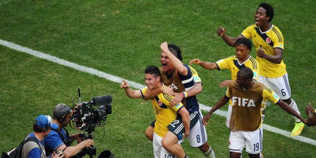 BRASILIA, BRAZIL - JUNE 19: James Rodriguez #10 of Colombia celebrates scoring his team's first goal during the 2014 FIFA World Cup Brazil Group C match between Colombia and Cote D'Ivoire at Estadio Nacional on June 19, 2014 in Brasilia, Brazil. (Photo by Adam Pretty/Getty Images)