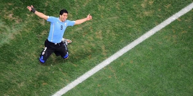 Uruguay's forward Luis Suarez celebrates his second goal during the Group D football match between Uruguay and England at the Corinthians Arena in Sao Paulo on June 19, 2014, during the 2014 FIFA World Cup. AFP PHOTO / FRANCOIS XAVIER MARIT/POOL (Photo credit should read FRANCOIS XAVIER MARIT/AFP/Getty Images)