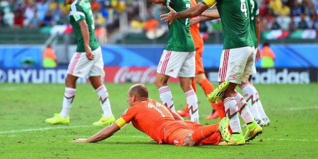 FORTALEZA, BRAZIL - JUNE 29: Rafael Marquez of Mexico reacts after a challenge on Arjen Robben of the Netherlands resulting in a yellow card for Marquez and a penalty kick for the Netherlands during the 2014 FIFA World Cup Brazil Round of 16 match between Netherlands and Mexico at Castelao on June 29, 2014 in Fortaleza, Brazil. (Photo by Laurence Griffiths/Getty Images)