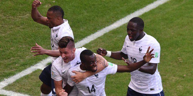 France's forward Olivier Giroud (front L) and France's midfielder Blaise Matuidi (front R) celebrate after Matuidi scored their team's second goal during a Group E football match between Switzerland and France at the Fonte Nova Arena in Salvador during the 2014 FIFA World Cup on June 20, 2014. AFP PHOTO / DIMITAR DILKOFF (Photo credit should read DIMITAR DILKOFF/AFP/Getty Images)