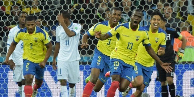 Ecuador's forward Enner Valencia (2ndR) celebrates with teammates after scoring a second goal during a Group E football match between Honduras and Ecuador at the Baixada Arena in Curitiba during the 2014 FIFA World Cup on June 20, 2014. AFP PHOTO / GABRIEL BOUYS (Photo credit should read GABRIEL BOUYS/AFP/Getty Images)