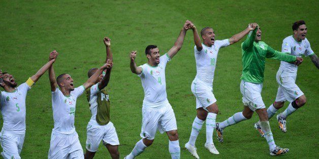 Algeria's players celebrate at the end of the Group H football match between South Korea and Algeria at the Beira-Rio Stadium in Porto Alegre during the 2014 FIFA World Cup on June 22, 2014. Algeria won 4-2. AFP PHOTO / PEDRO UGARTE (Photo credit should read PEDRO UGARTE/AFP/Getty Images)