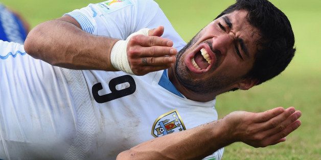 NATAL, BRAZIL - JUNE 24: Luis Suarez of Uruguay reacts during the 2014 FIFA World Cup Brazil Group D match between Italy and Uruguay at Estadio das Dunas on June 24, 2014 in Natal, Brazil. (Photo by Matthias Hangst/Getty Images)