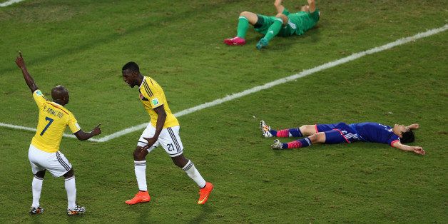 CUIABA, BRAZIL - JUNE 24: Jackson Martinez (R) celebrates scoring his team's second goal with Pablo Armero of Colombia during the 2014 FIFA World Cup Brazil Group C match between Japan and Colombia at Arena Pantanal on June 24, 2014 in Cuiaba, Brazil. (Photo by Warren Little/Getty Images)