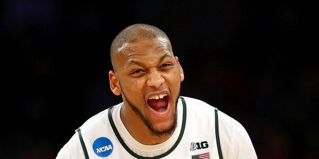 NEW YORK, NY - MARCH 30: Adreian Payne #5 of the Michigan State Spartans reacts after a basket in the second half against the Connecticut Huskies during the East Regional Final of the 2014 NCAA Men's Basketball Tournament at Madison Square Garden on March 30, 2014 in New York City. (Photo by Elsa/Getty Images)